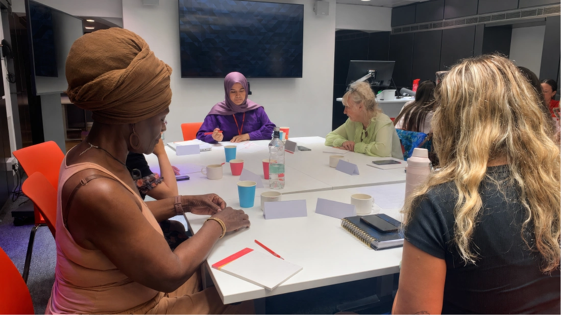 A photograph of a group of women taking part in the Tenants' Voice programme